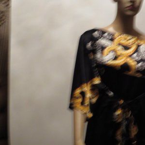 Flowing comfortable dress, black, gold, silver.